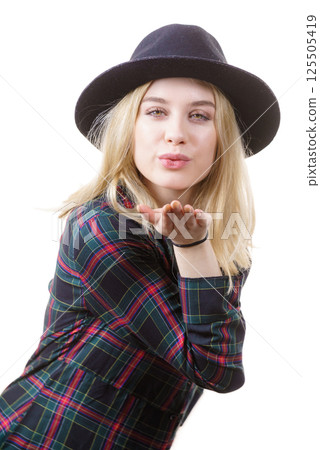 Woman in hat sending air kiss 125505419