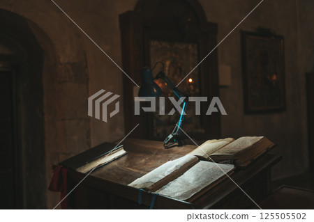 Interior of a Christian Orthodox Church with a table for reading the Bible and prayers 125505502