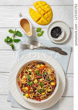 Thai Mango Noodle Veggie Salad in a bowl Thai Mango Noodle Veggie Salad in a bowl 125505762
