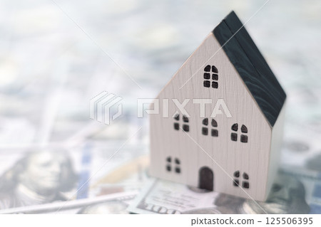 Finance home investments concept. Mortgage from the bank is essential for financing home investments, while insurance safeguards real estate property in volatile business of finance. house investment 125506395