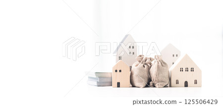 Home loans and real estate business concept. Mortgage from the bank for a property investment is a crucial finance concept in the realm of home loans and real estate business. banner with copy space. Home loans and real estate business concept. Mortgage from the bank for a property investment is a crucial finance concept in the realm of home loans and real estate business. banner with copy space. 125506429