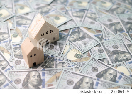 Finance home investments concept. Mortgage from the bank is essential for financing home investments, while insurance safeguards real estate property in volatile business of finance. house investment Finance home investments concept. Mortgage from the bank is essential for financing home investments, while insurance safeguards real estate property in volatile business of finance. house investment 125506439