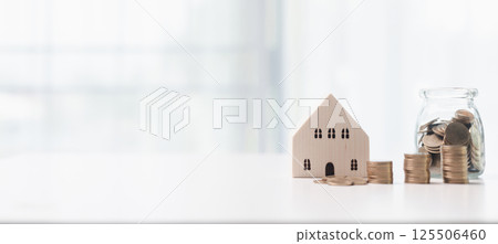 Home loans and real estate business concept. Mortgage from the bank for a property investment is a crucial finance concept in the realm of home loans and real estate business. banner with copy space. Home loans and real estate business concept. Mortgage from the bank for a property investment is a crucial finance concept in the realm of home loans and real estate business. banner with copy space. 125506460