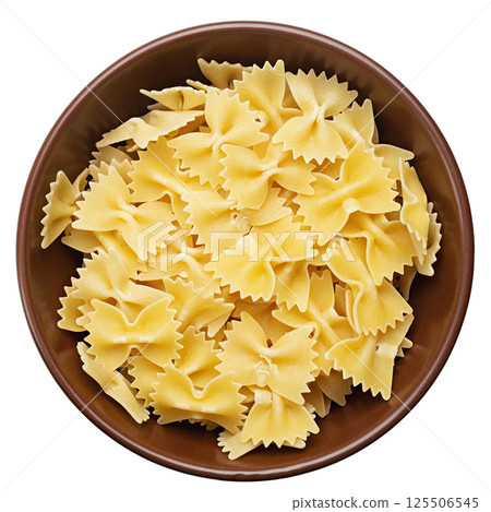 Raw farfalle pasta in a bowl isolated on white background. File Contains Clipping Path. Raw farfalle pasta in a bowl isolated on white background. File Contains Clipping Path. 125506545
