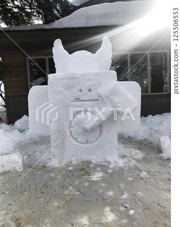 McCall, Idaho, USA - 01.27.2019: Snow figure in the city during snowy weather on Payette Lake. Sunset 125506553