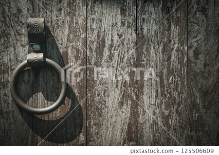 Old barn wooden door with iron ring. Lock door background Old barn wooden door with iron ring. Lock door background 125506609