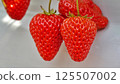 The sweet aroma of greenhouse-grown strawberries tickles your nose. 125507002