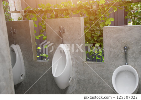 Male urinal, men's bathroom, decorated in a loft style 125507022