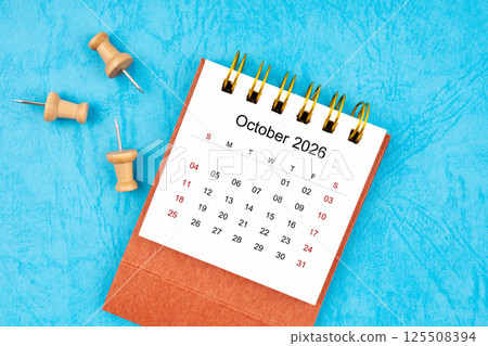 October 2026 mini calendar with wooden thumbtack. October 2026 mini calendar with wooden thumbtack. 125508394