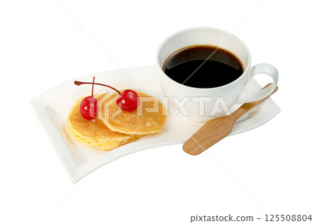coffee cup with pancakes and cherry isolated. 125508804