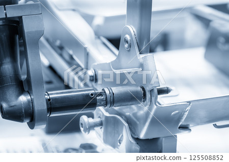 Automotive parts assembly process by the pneumatic wrench in the light blue scene. Automotive parts assembly process by the pneumatic wrench in the light blue scene. 125508852