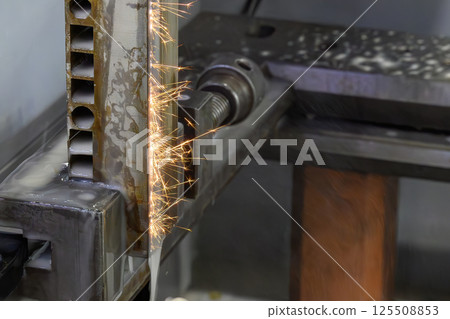 Closeup scene the wire EDM machine cutting the mold insert parts. 125508853