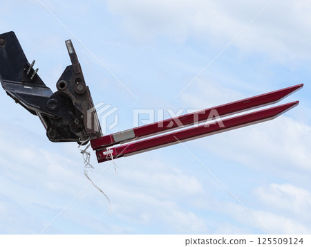Forklift loader on sky background 125509124