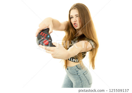 Gamer woman holding gaming pad Gamer woman holding gaming pad 125509137