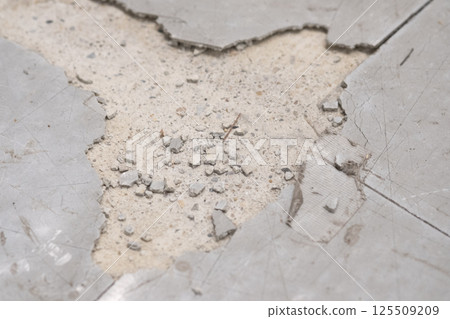 Image of P tiles cracked due to aging (stock photo) Image of P tiles cracked due to aging (stock photo) 125509209
