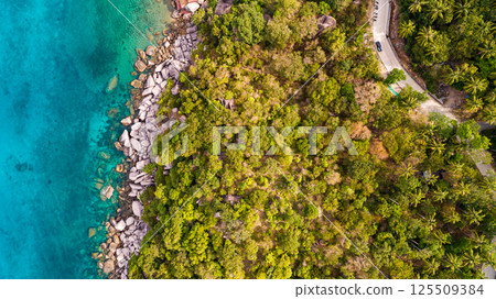 Top view seashore waves nature background,Amazing waves crashing on rocks seascape view Top view seashore waves nature background,Amazing waves crashing on rocks seascape view 125509384