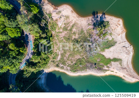 Top view seashore waves nature background,Amazing waves crashing on rocks seascape view Top view seashore waves nature background,Amazing waves crashing on rocks seascape view 125509419
