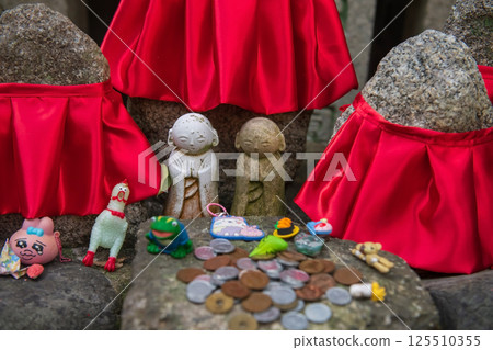 Jjizo statues with toy and coins and toys of Yasaka Koshindo temple, Kyoto 125510355