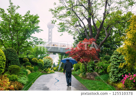 Tourist man walk at North Bund green land park, Shanghai 125510378