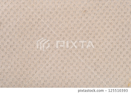 Closeup texture of back side of light brown laundry bag. Closeup texture of back side of light brown laundry bag. 125510393
