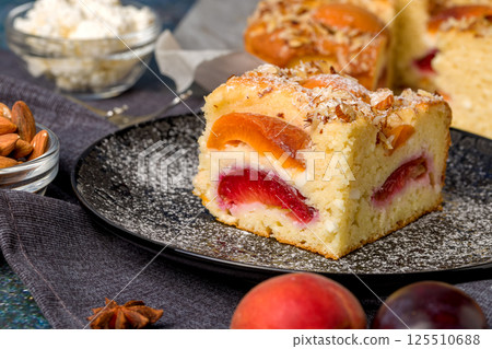 Cottage cheese pie with apricot and plum 125510688