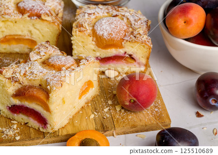 Cottage cheese pie with apricot and plum 125510689