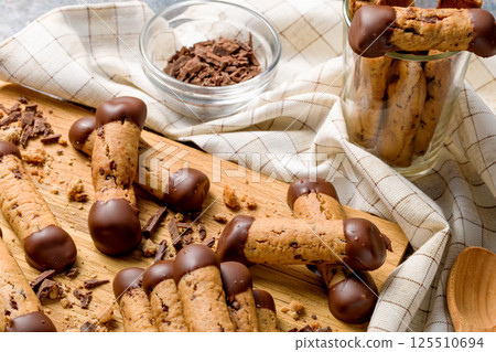 Sticks shortbread dipped in chocolate. Home made cookies Sticks shortbread dipped in chocolate. Home made cookies 125510694