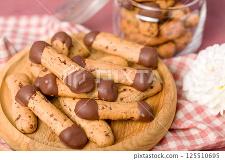Sticks shortbread dipped in chocolate. Home made cookies Sticks shortbread dipped in chocolate. Home made cookies 125510695