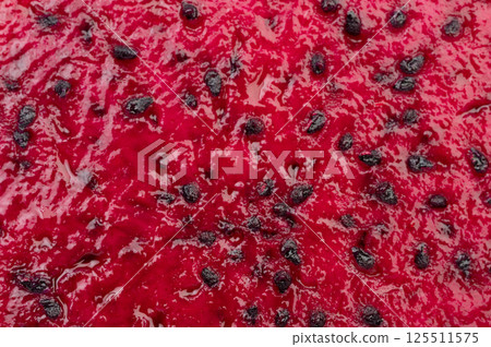 Red pulp with black small seeds 125511575
