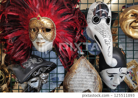 Venetian masks for sale on a market stall Venetian masks for sale on a market stall 125511893