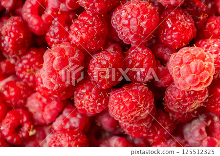 Fresh ripe raspberries forming a textured background for healthy eating 125512325