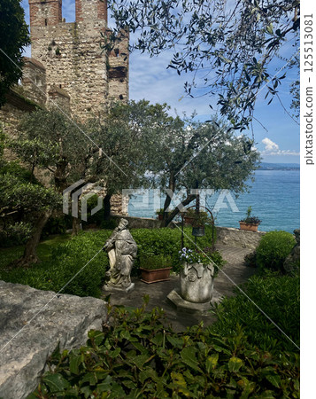 Scenic View of a castle garden overlooking lake Garda, Sirmione, Italy Scenic View of a castle garden overlooking lake Garda, Sirmione, Italy 125513081