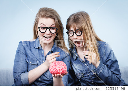 Two crazy women friends thinking Two crazy women friends thinking 125513496
