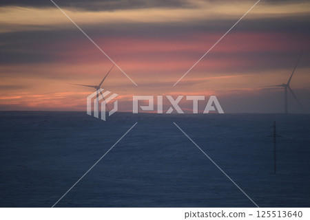 Wind Turbine at Sunset in a Winter Landscape Wind Turbine at Sunset in a Winter Landscape 125513640