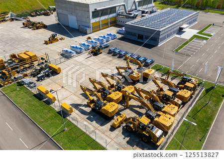 Solar powered construction machinery distribution and service center. Aerial view Solar powered construction machinery distribution and service center. Aerial view 125513827