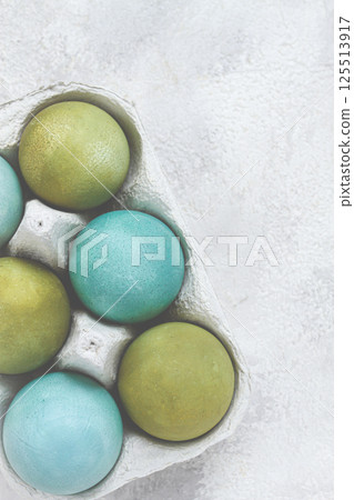 Easter colored eggs, in green and turquoise tones, Easter card, top view, no people, Easter colored eggs, in green and turquoise tones, Easter card, top view, no people, 125513917