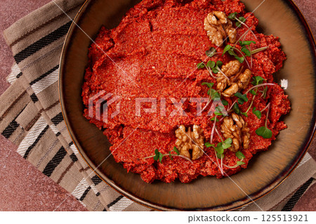 Mahammara red pepper sauce, with walnuts, and sprigs of fresh microgreens, homemade, no people, 125513921