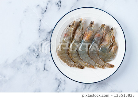 Fresh raw white-footed shrimp, tiger prawns vannamei, on a white plate, 125513923