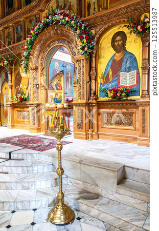 Paschal Artos (Easter bread) in front of opened royal doors. An artos is a loaf of leavened bread Paschal Artos (Easter bread) in front of opened royal doors. An artos is a loaf of leavened bread 125513987