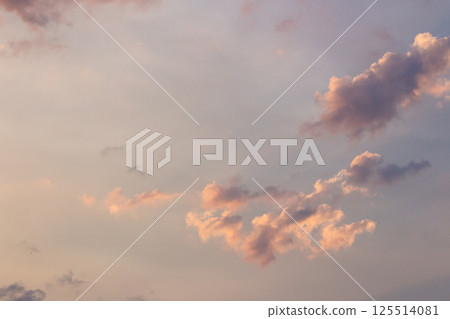 cumulus clouds on the sky blown by the wind. meditation at dusk. cloudy weather meteorology background in orange glow. evening mood cumulus clouds on the sky blown by the wind. meditation at dusk. cloudy weather meteorology background in orange glow. evening mood 125514081