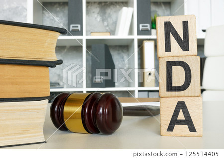 Non-disclosure agreement NDA and gavel. Confidentiality protection. 125514405