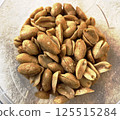 glass bowl of peanuts 125515284