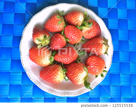 Strawberries on the table as background. Fruits Strawberries on the table as background. Fruits 125515538