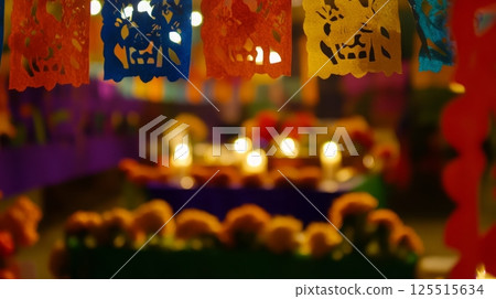 Colorful papel picado and candles at a day of the dead altar celebration 125515634