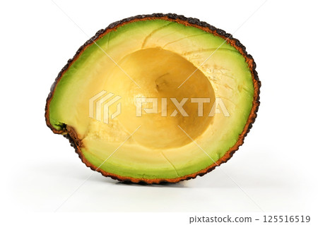 Brown avocado cut in half, isolated on white background, side view Brown avocado cut in half, isolated on white background, side view 125516519