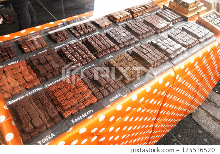 Selection of artisan chocolates variety displayed at stall in Borough Market, London 125516520