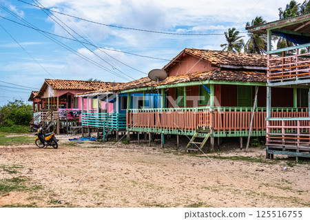 Colorful natural-framed houses with balconies at Pesqueiro, Soure in Marajo Island, Brazil. Colorful natural-framed houses with balconies at Pesqueiro, Soure in Marajo Island, Brazil. 125516755