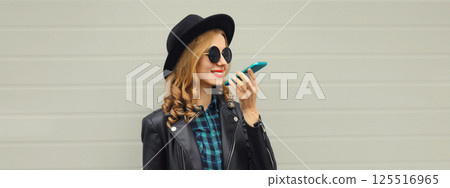 Beautiful happy smiling young woman calling on phone, stylish girl talking on the smartphone Beautiful happy smiling young woman calling on phone, stylish girl talking on the smartphone 125516965