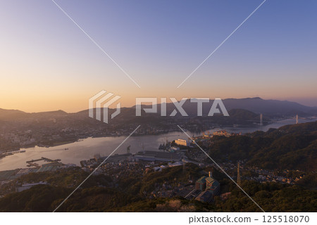 Nagasaki at dawn as seen from Mount Inasa, and the city bathed in the morning sun Nagasaki at dawn as seen from Mount Inasa, and the city bathed in the morning sun 125518070