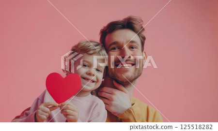 Little boy hug with father holding red love paper shape 125518282